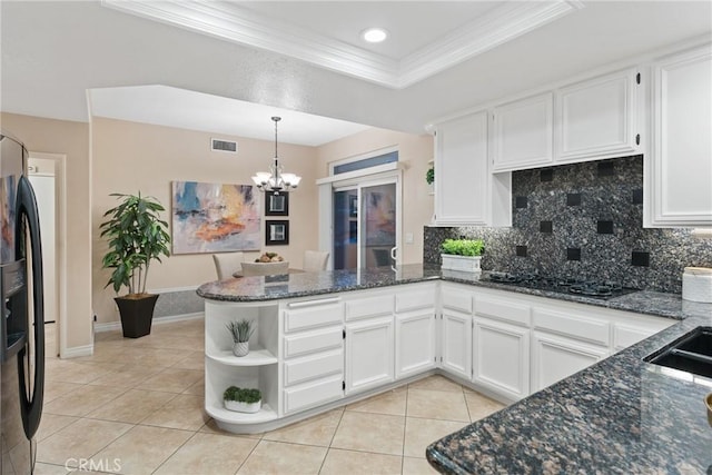 530 S Laureltree Dr, Anaheim Hills, CA 92808 - kitchen with a peninsula, light tile patterned flooring, ornamental molding, white cabinetry, and a chandelier