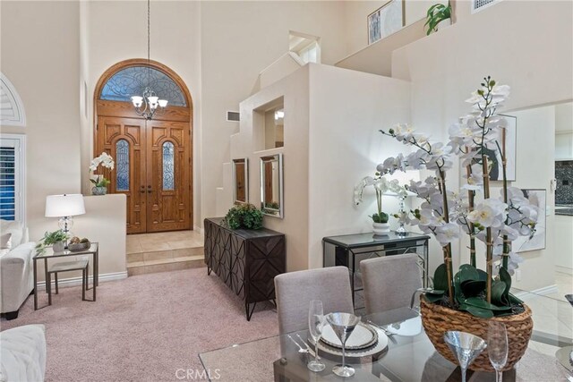 530 S Laureltree Dr, Anaheim Hills, CA 92808 - carpeted entrance foyer featuring a high ceiling and a chandelier