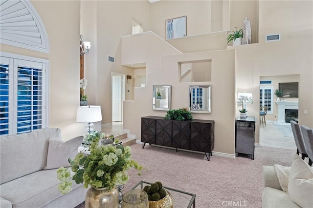 530 S Laureltree Dr, Anaheim Hills, CA 92808 - carpeted living room with a high ceiling and baseboards