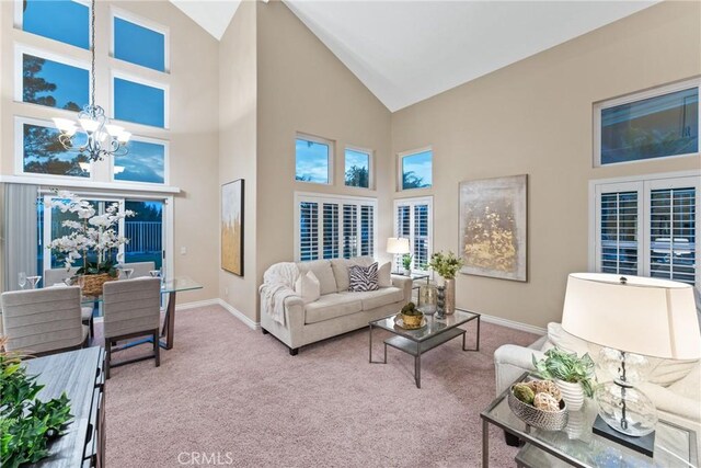 530 S Laureltree Dr, Anaheim Hills, CA 92808 - living area with a chandelier, high vaulted ceiling, and carpet flooring