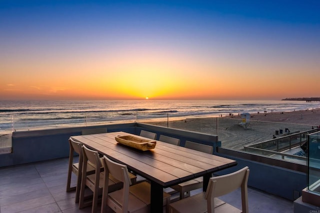 3879 Ocean Front Walk, San Diego, CA 92109 - patio terrace at dusk featuring view of water and beach and outdoor dining space