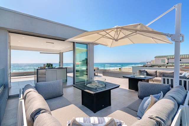 3879 Ocean Front Walk, San Diego, CA 92109 - view of patio with an outdoor living space with a fire pit and a water view