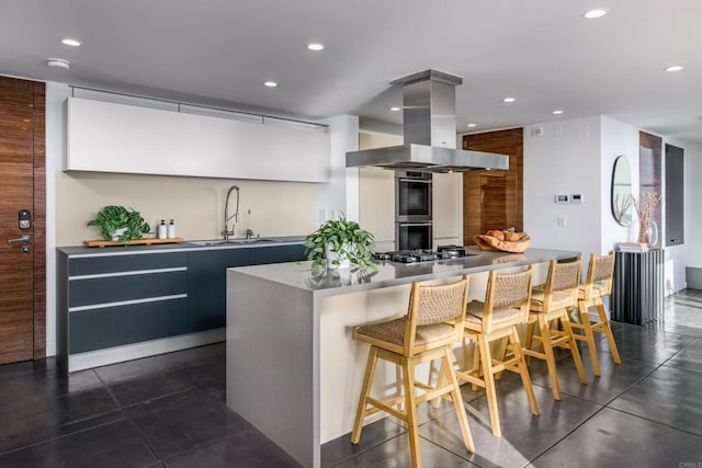 3879 Ocean Front Walk, San Diego, CA 92109 - kitchen with a sink, island range hood, modern cabinets, recessed lighting, and a breakfast bar