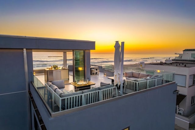 3879 Ocean Front Walk, San Diego, CA 92109 - balcony at dusk featuring an outdoor living space with a fire pit and a water view