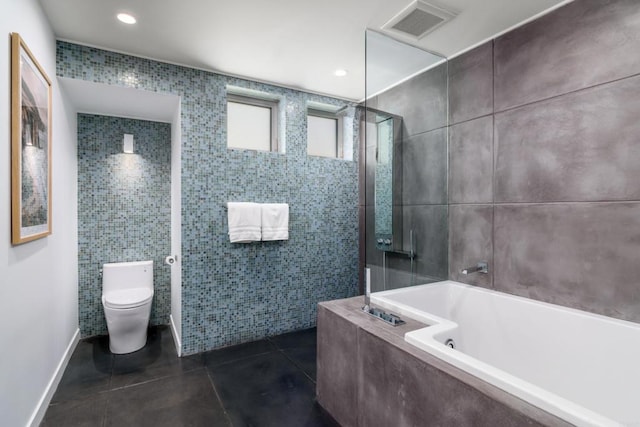 3879 Ocean Front Walk, San Diego, CA 92109 - bathroom with tile walls, toilet, a bath, tiled shower, and tile patterned floors