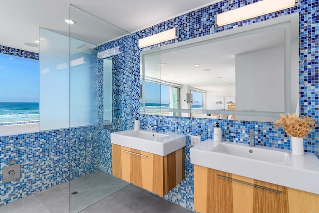 3879 Ocean Front Walk, San Diego, CA 92109 - full bathroom with tile walls, two vanities, tasteful backsplash, tile patterned flooring, and a water view