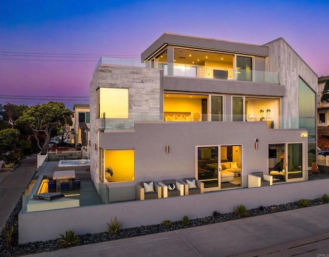 3879 Ocean Front Walk, San Diego, CA 92109 - back of house at dusk featuring a balcony