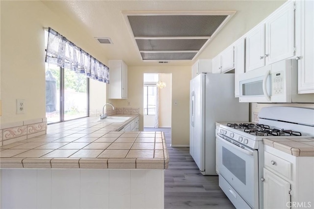 1573 E Brockton Ave, Redlands, CA 92374 - kitchen with white appliances, a sink, tile counters, white cabinetry, and light wood-type flooring