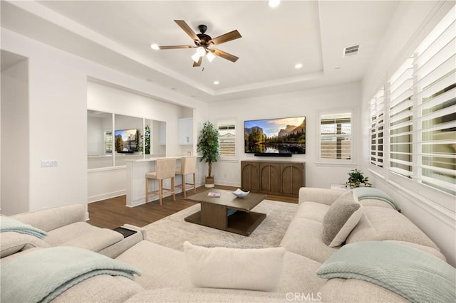 11638 Oakton Way, Corona, CA 92883 - living area with recessed lighting, wood finished floors, ceiling fan, and a tray ceiling