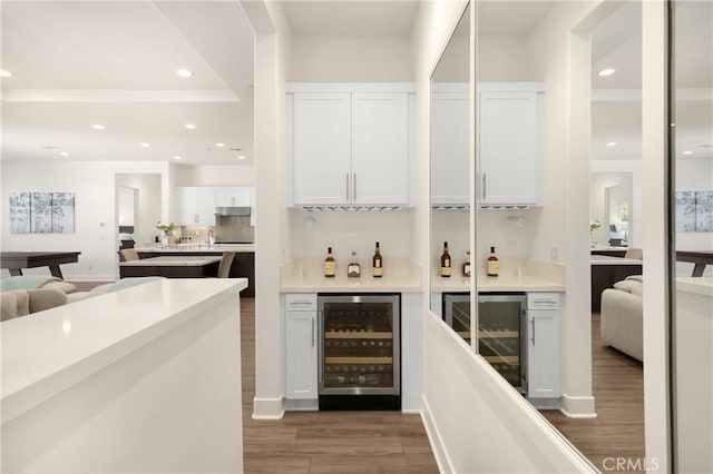 11638 Oakton Way, Corona, CA 92883 - indoor dry bar featuring wine cooler, wood finished floors, recessed lighting, and under cabinet range hood