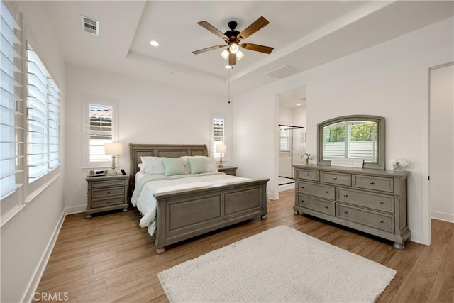 11638 Oakton Way, Corona, CA 92883 - bedroom featuring a tray ceiling, light wood finished floors, baseboards, recessed lighting, and a ceiling fan