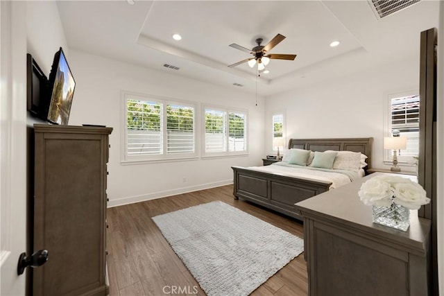 11638 Oakton Way, Corona, CA 92883 - bedroom featuring a tray ceiling, dark wood-style floors, recessed lighting, baseboards, and a ceiling fan