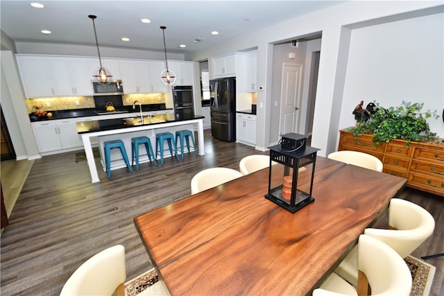 35582 Laurel Tree Ct, Winchester, CA 92596 - dining space with dark wood-style flooring and recessed lighting