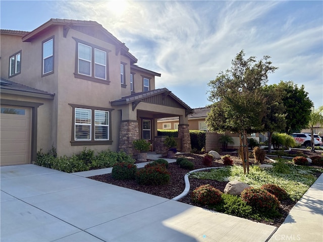 35582 Laurel Tree Ct, Winchester, CA 92596 - view of front of property with stucco siding, concrete driveway, a garage, stone siding, and a tile roof