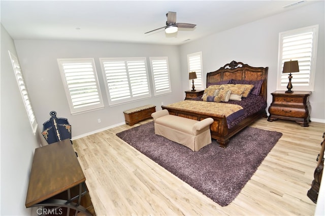 35582 Laurel Tree Ct, Winchester, CA 92596 - bedroom featuring multiple windows, wood finished floors, baseboards, and ceiling fan