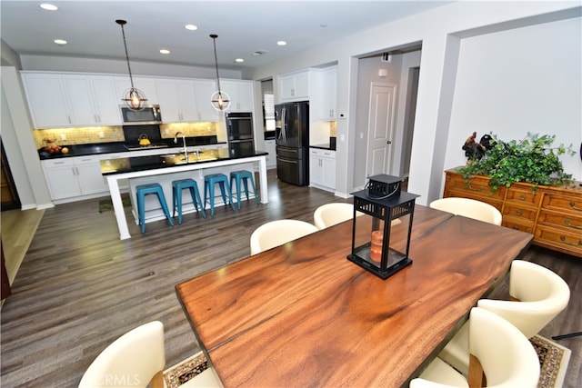 35582 Laurel Tree Ct, Winchester, CA 92596 - dining area with dark wood finished floors and recessed lighting