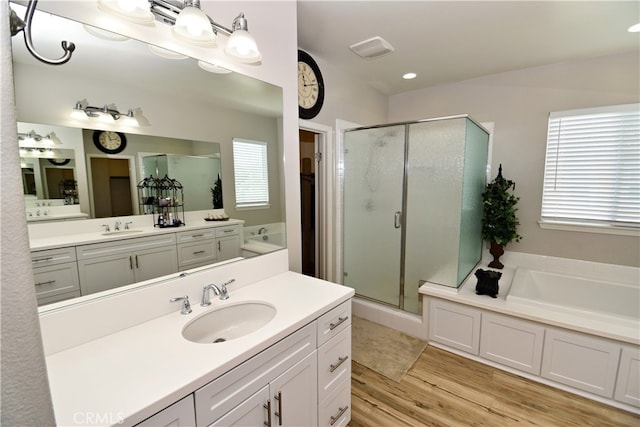 35582 Laurel Tree Ct, Winchester, CA 92596 - full bath featuring a garden tub, a stall shower, vanity, and wood finished floors