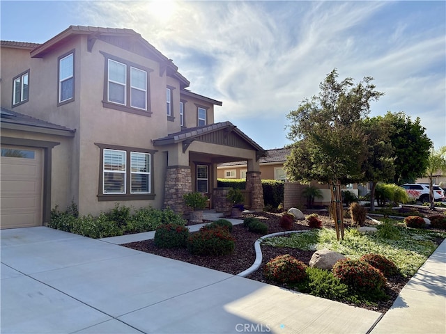 35582 Laurel Tree Ct, Winchester, CA 92596 - view of front of property with stucco siding, concrete driveway, a garage, stone siding, and a tiled roof