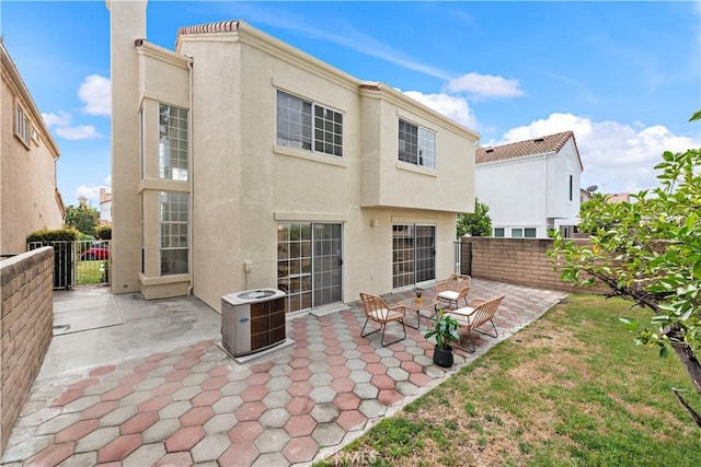 7455 Bellingham Ave, North Hollywood, CA 91605 - rear view of property featuring stucco siding, a fenced backyard, and a patio area