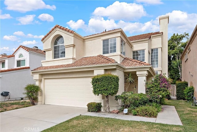 7455 Bellingham Ave, North Hollywood, CA 91605 - mediterranean / spanish-style home with a tiled roof, stucco siding, and driveway
