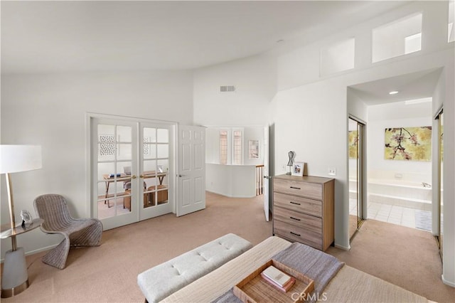 7455 Bellingham Ave, North Hollywood, CA 91605 - bedroom with light colored carpet, high vaulted ceiling, and connected bathroom