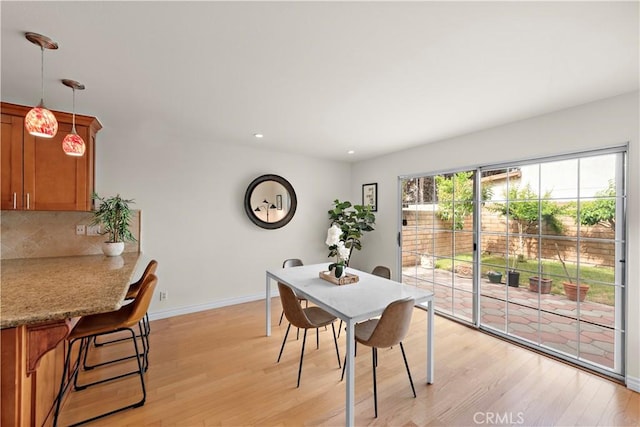 7455 Bellingham Ave, North Hollywood, CA 91605 - dining space with light wood-style floors, baseboards, and recessed lighting
