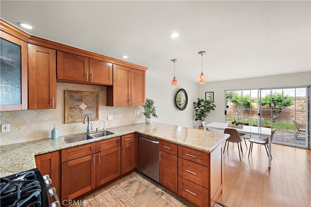 7455 Bellingham Ave, North Hollywood, CA 91605 - kitchen featuring stainless steel dishwasher, a sink, brown cabinets, a peninsula, and recessed lighting