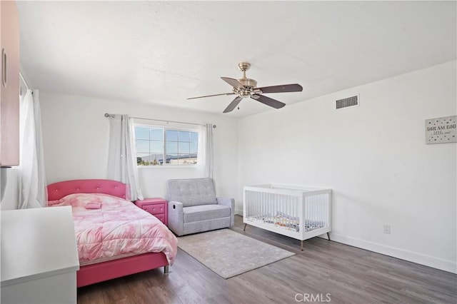 9021 Oneida Ave, Sun Valley, CA 91352 - bedroom with wood finished floors, a ceiling fan, and baseboards