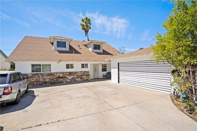 9021 Oneida Ave, Sun Valley, CA 91352 - view of front of property with stone siding, stucco siding, and a shingled roof