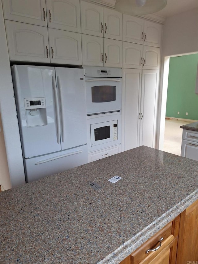 659 Larkspur Ct, San Marcos, CA 92078 - kitchen with white appliances, dark stone countertops, and white cabinets