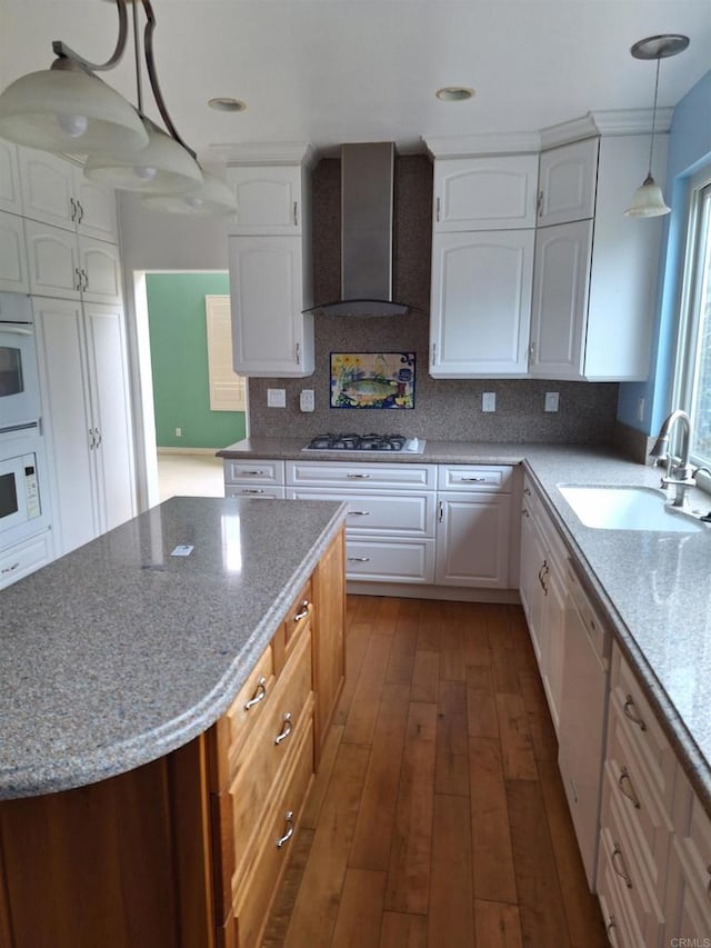 659 Larkspur Ct, San Marcos, CA 92078 - kitchen featuring wall chimney range hood, white appliances, white cabinetry, decorative backsplash, and recessed lighting
