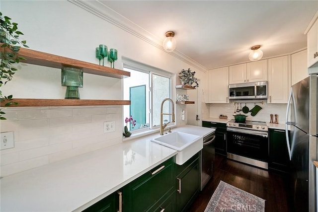 15544 Andorra Way, San Diego, CA 92129 - kitchen with appliances with stainless steel finishes, open shelves, green cabinetry, light countertops, and tasteful backsplash