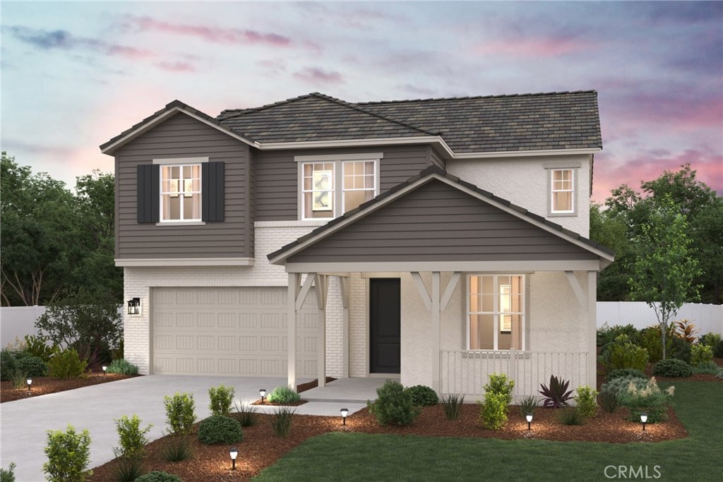 16696 Dara Ave, Chino, CA 91708 - traditional home featuring a porch, an attached garage, driveway, and brick siding