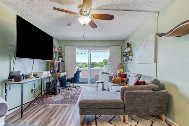 5585 E Pacific Coast Unit 361, Long Beach, CA 90804 - living area with a textured ceiling, a ceiling fan, and wood finished floors