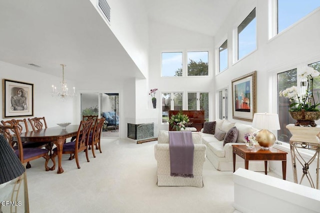 2911 Butter Creek Dr, Pasadena, CA 91107 - living room with high vaulted ceiling, a chandelier, and carpet floors
