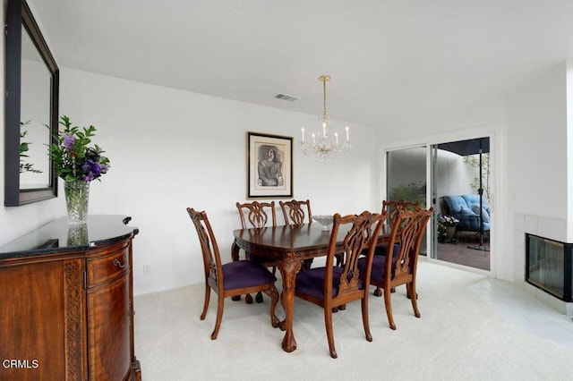 2911 Butter Creek Dr, Pasadena, CA 91107 - dining room featuring a chandelier, light colored carpet, and a tile fireplace