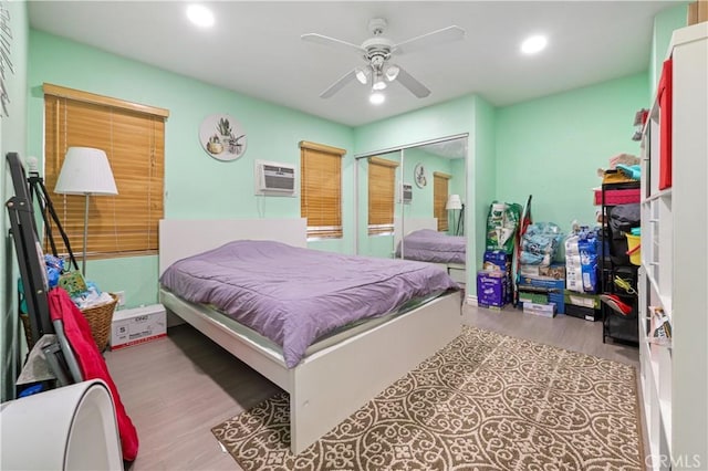 1257 E Grand Ave Unit A, Escondido, CA 92027 - bedroom featuring wood finished floors, recessed lighting, a wall mounted AC, a ceiling fan, and a closet