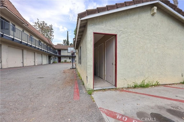 1257 E Grand Ave Unit A, Escondido, CA 92027 - view of side of property featuring stucco siding