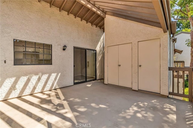 26701 Quail Unit 61, Laguna Hills, CA 92656 - doorway to property with stucco siding and a patio area