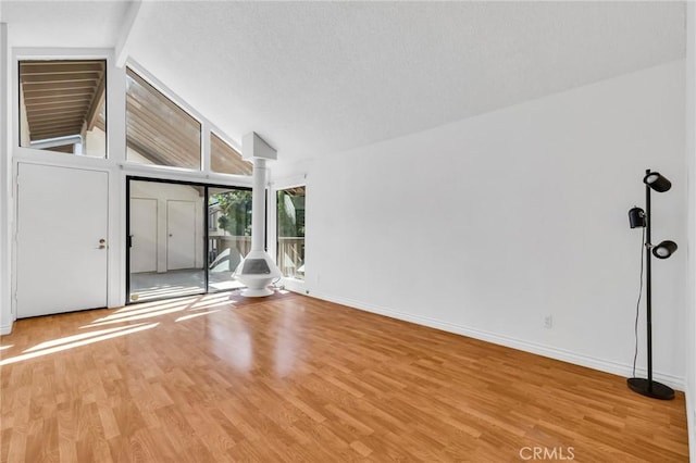 26701 Quail Unit 61, Laguna Hills, CA 92656 - unfurnished living room featuring wood finished floors and baseboards