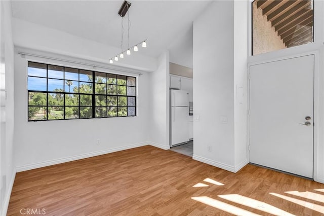 26701 Quail Unit 61, Laguna Hills, CA 92656 - interior space with light wood-style floors, baseboards, and high vaulted ceiling