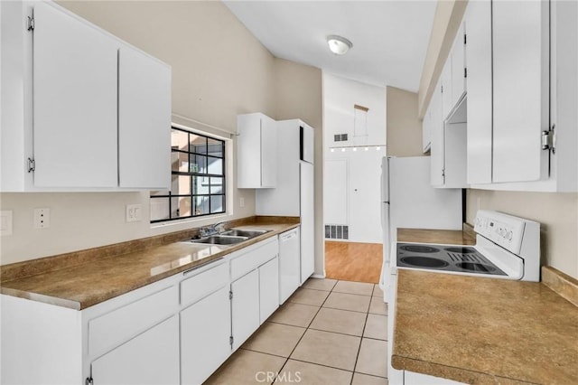 26701 Quail Unit 61, Laguna Hills, CA 92656 - kitchen featuring a sink, white appliances, white cabinets, and light tile patterned flooring
