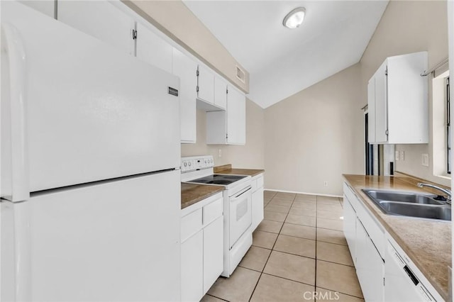 26701 Quail Unit 61, Laguna Hills, CA 92656 - kitchen with white appliances, a sink, lofted ceiling, white cabinetry, and light tile patterned floors