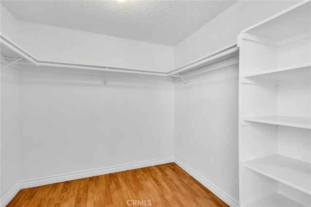 26701 Quail Unit 61, Laguna Hills, CA 92656 - walk in closet with wood finished floors