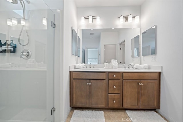 843 Longhorn Way, Rancho Mission Viejo, CA 92694 - full bathroom featuring a stall shower, double vanity, tile patterned flooring, and baseboards