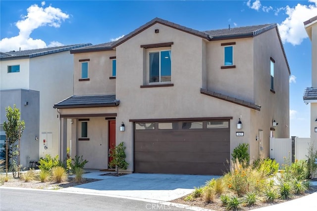 843 Longhorn Way, Rancho Mission Viejo, CA 92694 - view of front facade featuring an attached garage, stucco siding, driveway, and a tiled roof