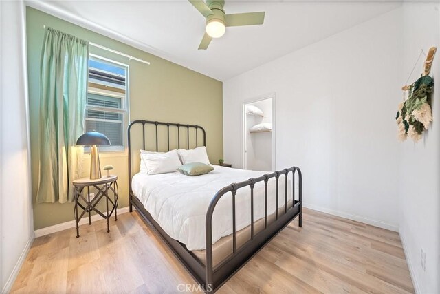 843 Longhorn Way, Rancho Mission Viejo, CA 92694 - bedroom with light wood finished floors, baseboards, a ceiling fan, and a spacious closet