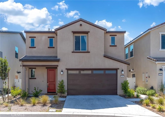 843 Longhorn Way, Rancho Mission Viejo, CA 92694 - view of property with a garage, stucco siding, and concrete driveway