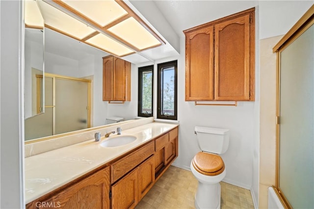 13601 Del Monte Dr Unit 75, Seal Beach, CA 90740 - bathroom with toilet, an enclosed shower, vanity, tile patterned floors, and baseboards