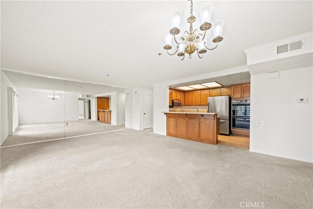 13601 Del Monte Dr Unit 75, Seal Beach, CA 90740 - unfurnished living room featuring a chandelier and light carpet